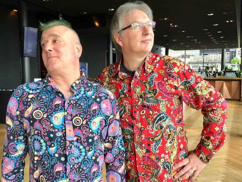 Bruce and Jeremy wearing the type of shirts that defy description in an alt tag 